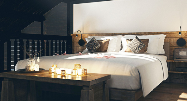 Phòng ngủ ấm cúng với đồ nội thất gỗ mộc cùng ánh đèn vàng.
